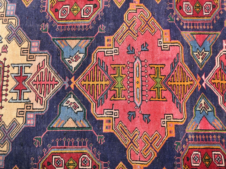 a colorful rug with many different designs on it