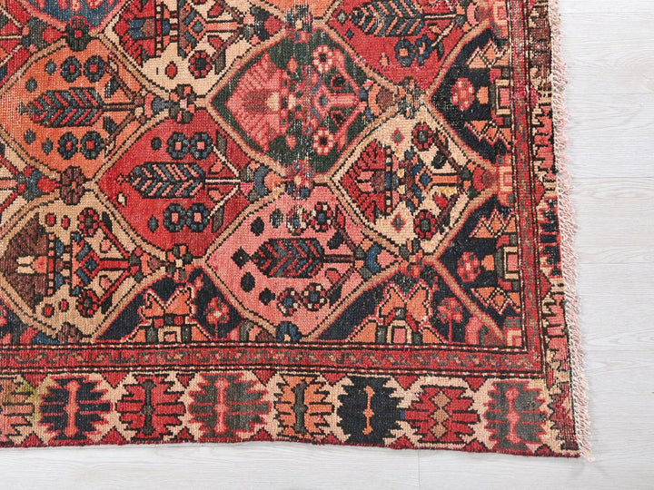 a red and blue rug on a white floor
