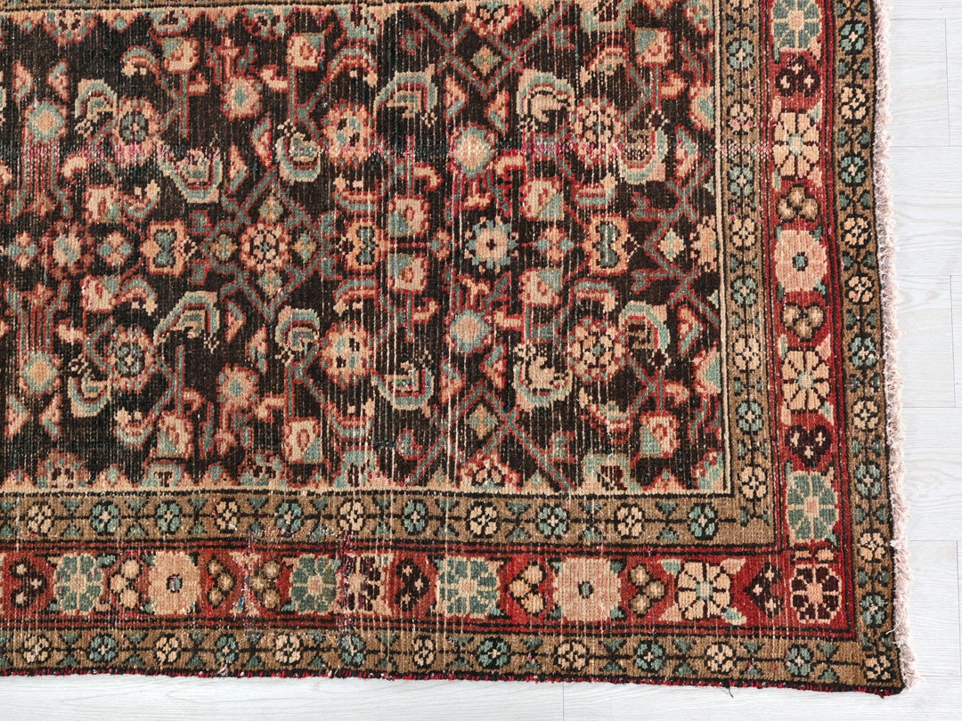 an old rug with a red and blue design on it