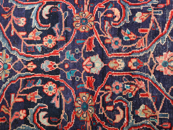 a close up of a blue and red rug