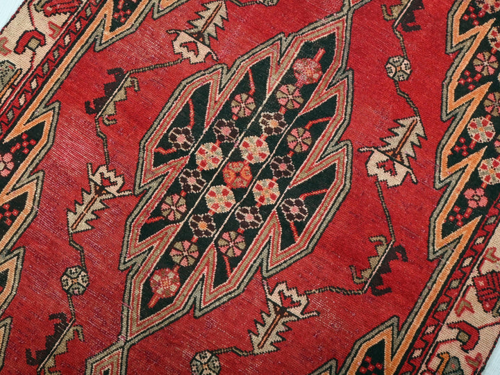 a close up of a red oriental rug