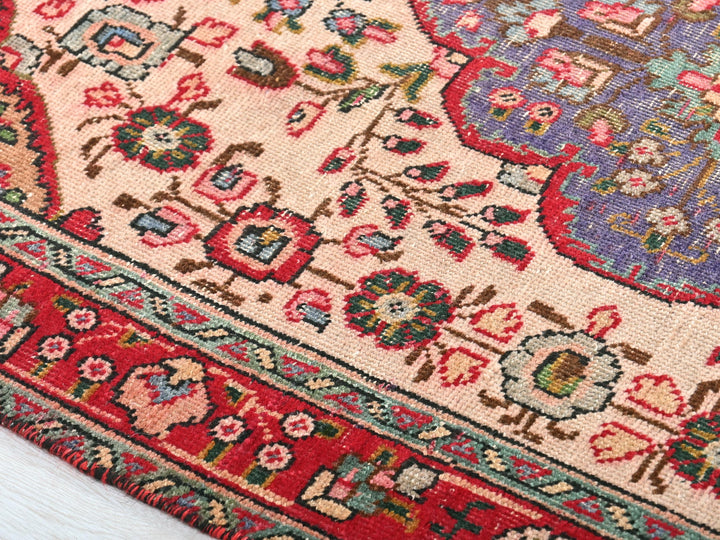 a close up of a rug on a white surface