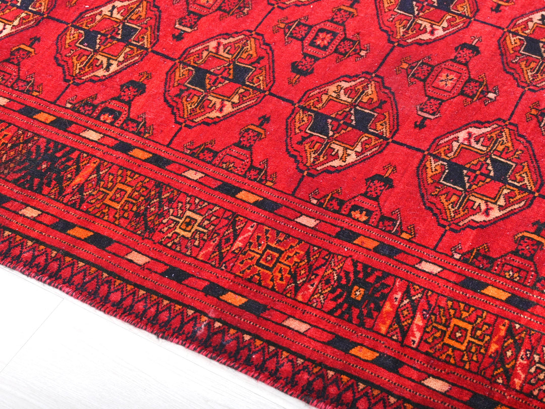 a close up of a red oriental rug