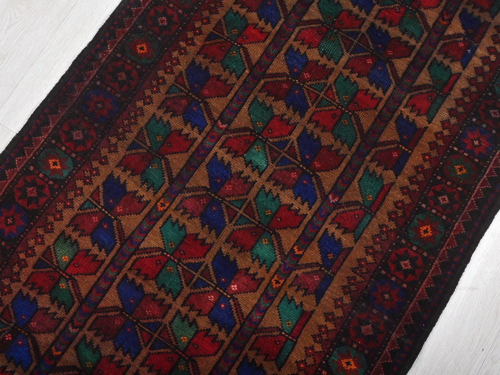 a colorful rug is laying on the floor