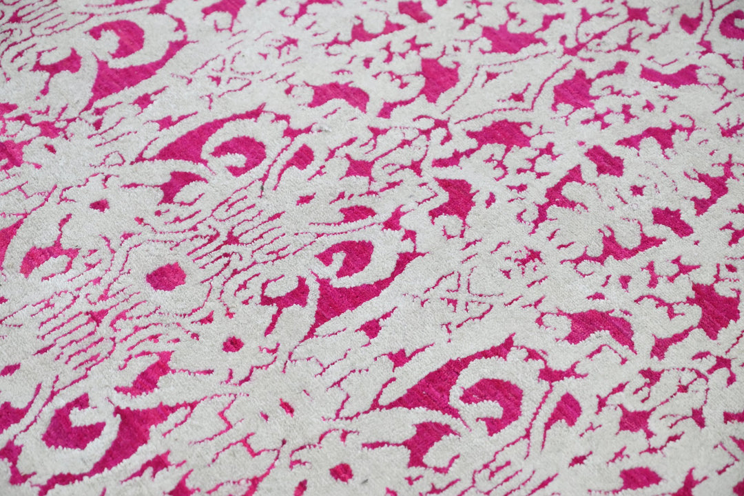 pink Medium rug 6' 2" x 9' 0"