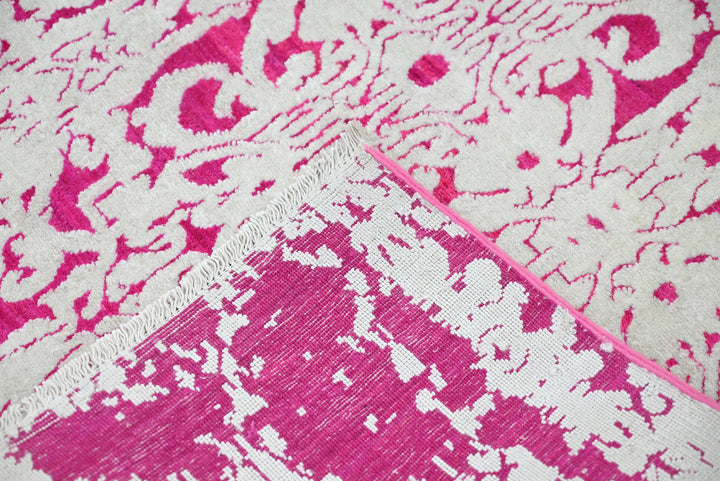 pink Medium rug 6' 2" x 9' 0"