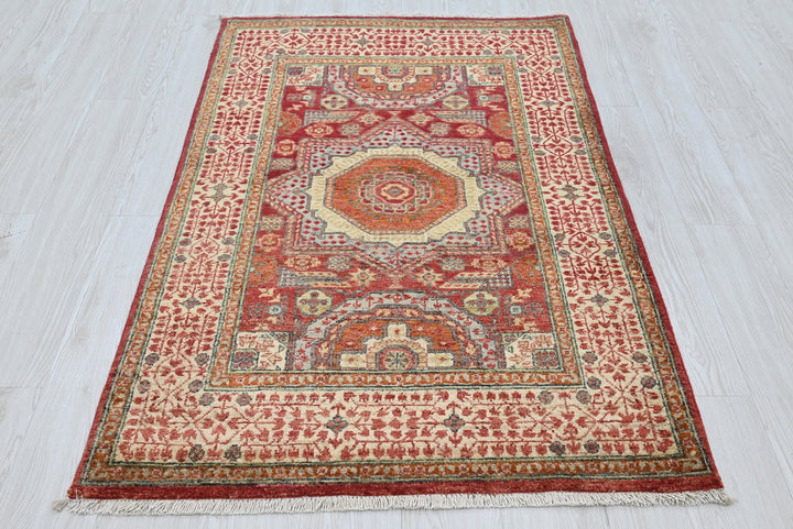 red Accent rug 3' 4" x 5' 2"