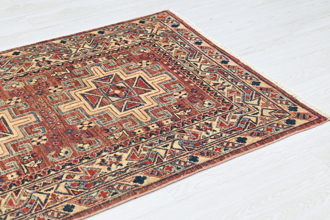 red Accent rug 3' 4" x 4' 10"