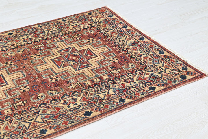 red Accent rug 3' 4" x 4' 10"