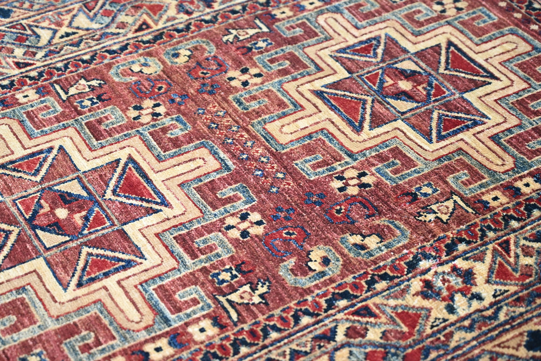 red Accent rug 3' 4" x 4' 10"