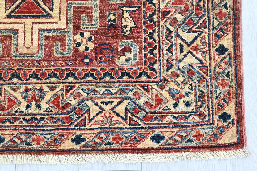 red Accent rug 3' 4" x 4' 10"