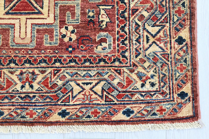 red Accent rug 3' 4" x 4' 10"
