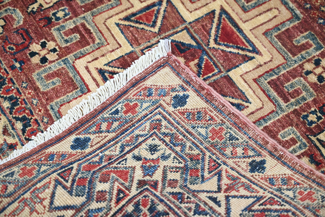 red Accent rug 3' 4" x 4' 10"