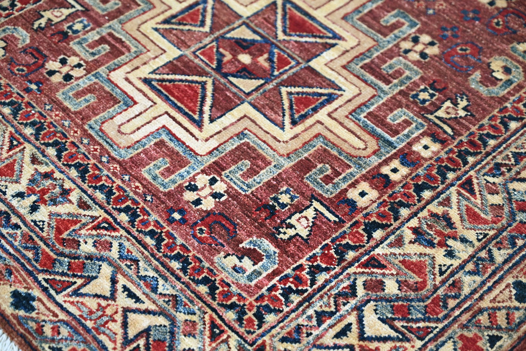 red Accent rug 3' 4" x 4' 10"