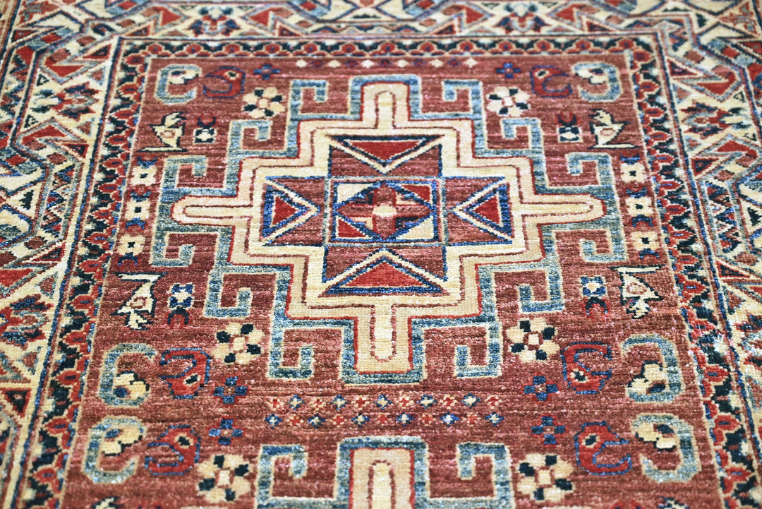red Accent rug 3' 4" x 4' 10"