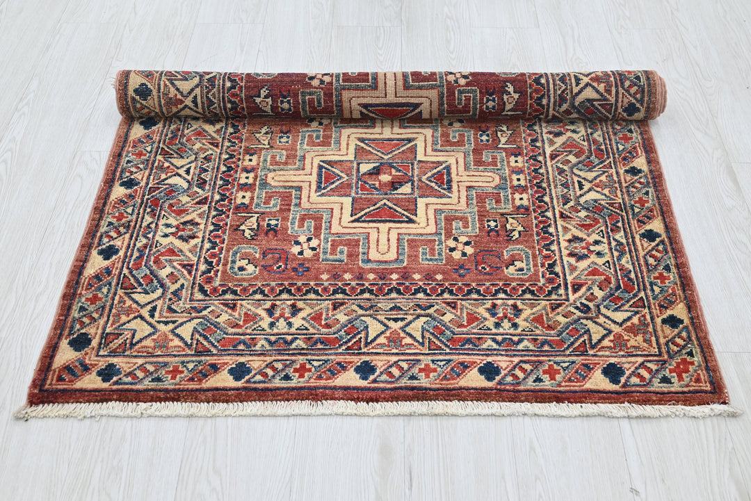 red Accent rug 3' 4" x 4' 10"