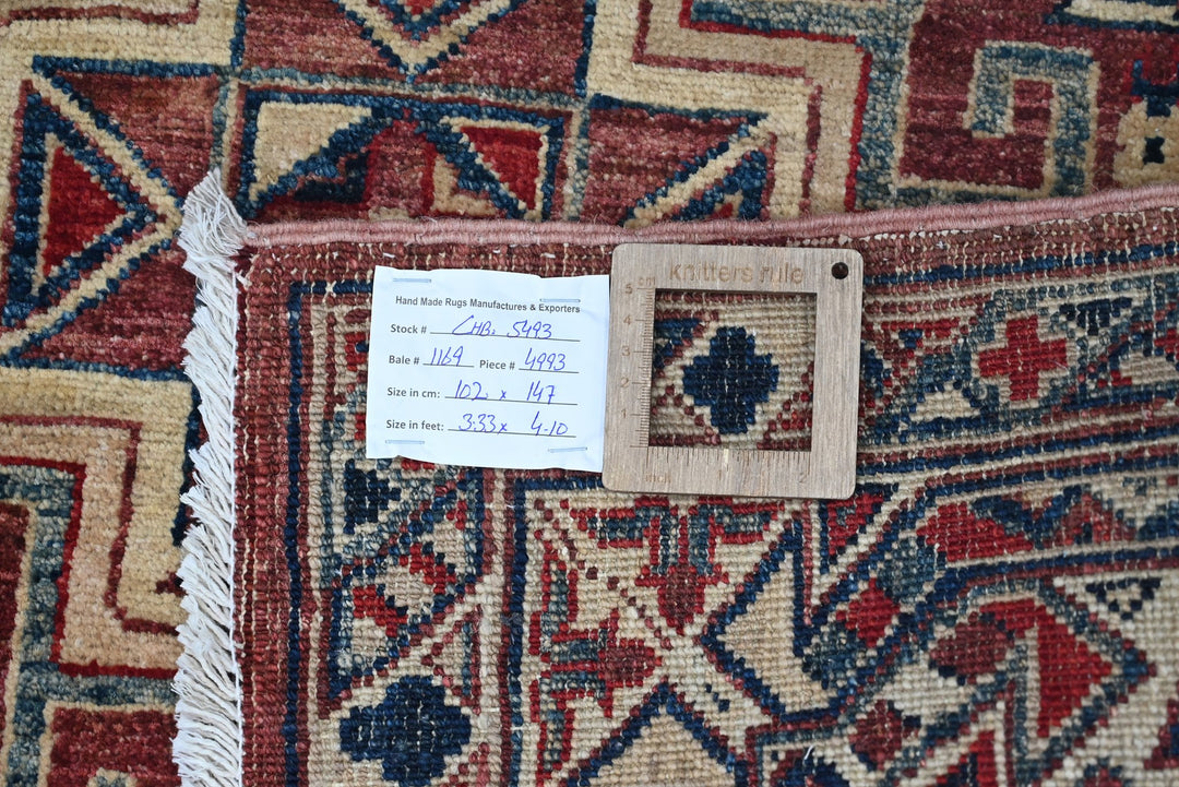 red Accent rug 3' 4" x 4' 10"