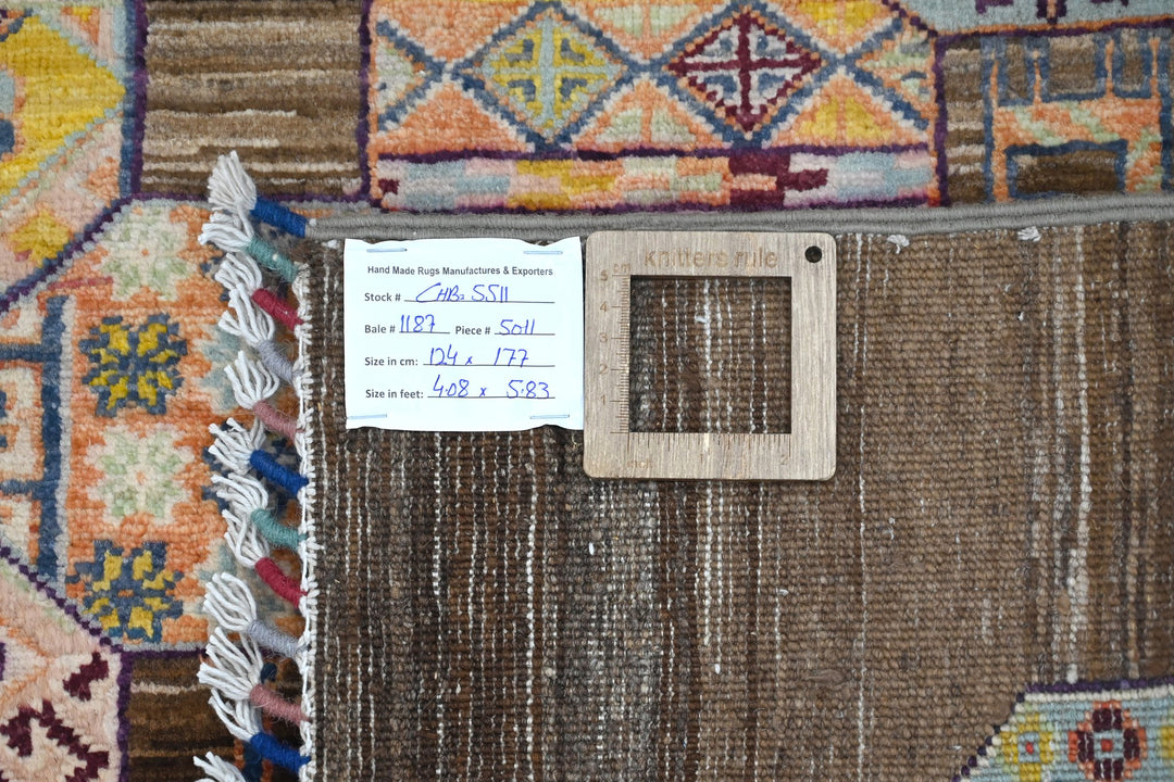 brown Accent rug 4' 1" x 5' 10"