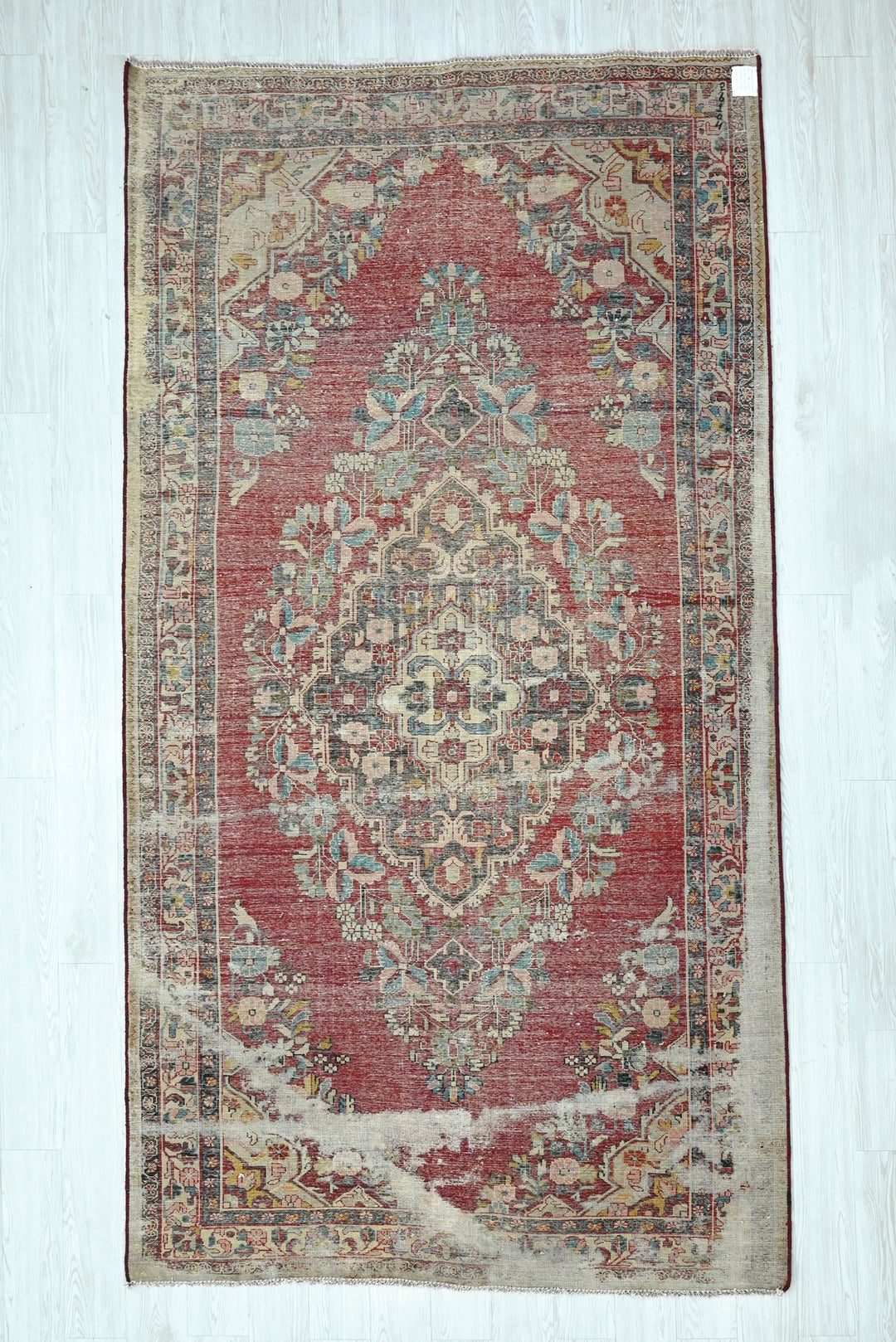 red Large rug 5' 5" x 10' 0"