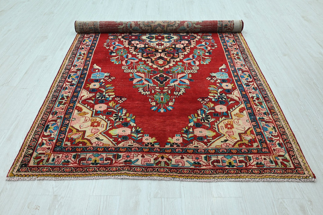 red Large rug 5' 5" x 10' 0"