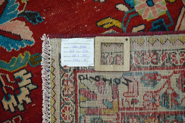red Large rug 5' 5" x 10' 0"