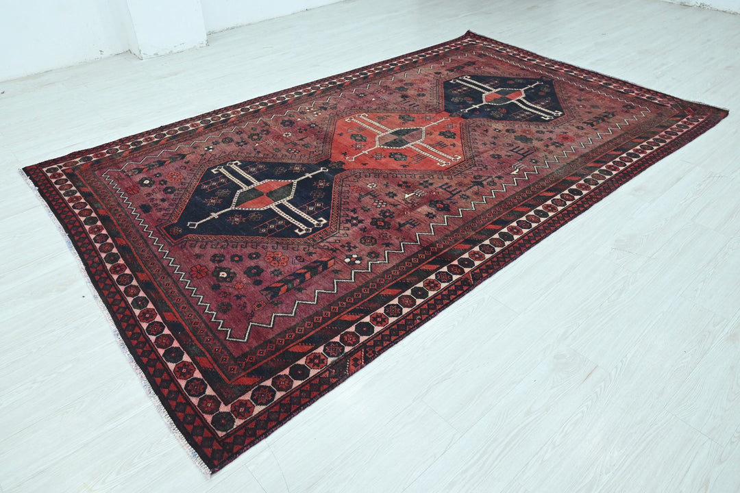 red Large rug 6' 0" x 9' 11"