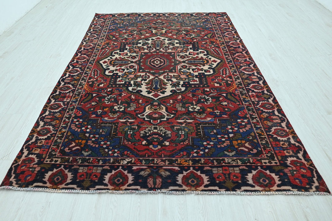 red Medium rug 6' 2" x 9' 4"