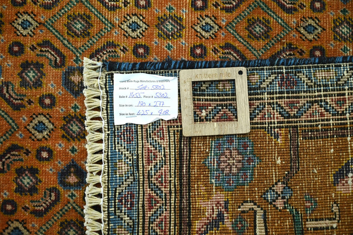 orange Medium rug 6' 3" x 9' 1"