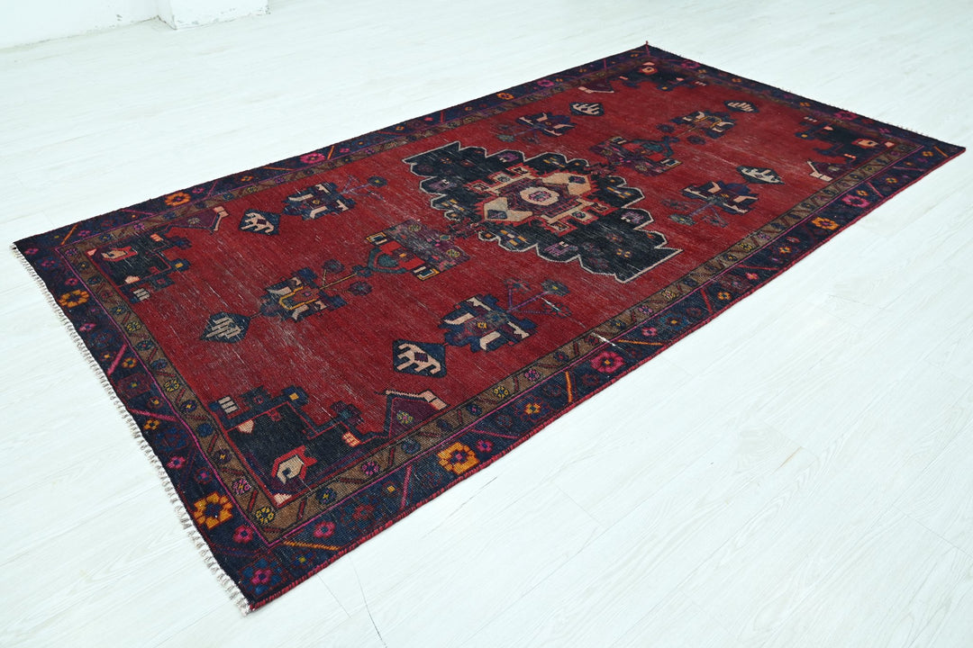 red Medium rug 4' 8" x 8' 10"