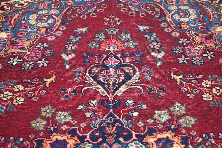 red Large rug 7' 1" x 10' 5"