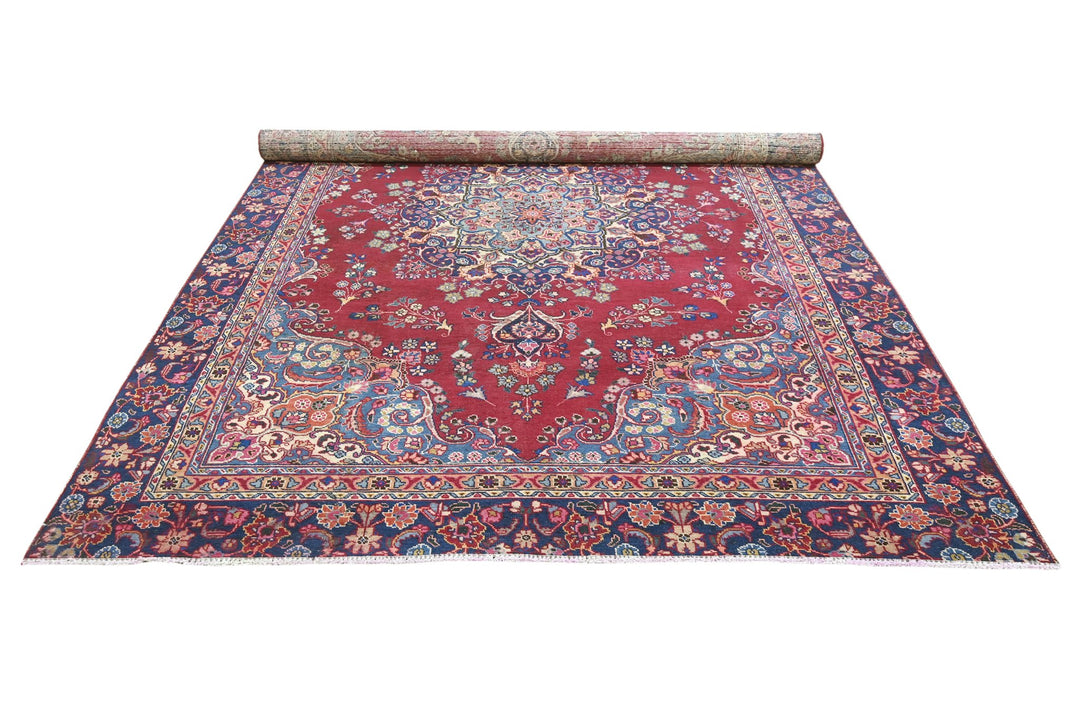 red Large rug 7' 1" x 10' 5"