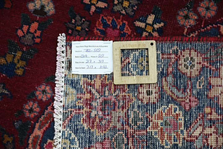 red Large rug 7' 1" x 10' 5"