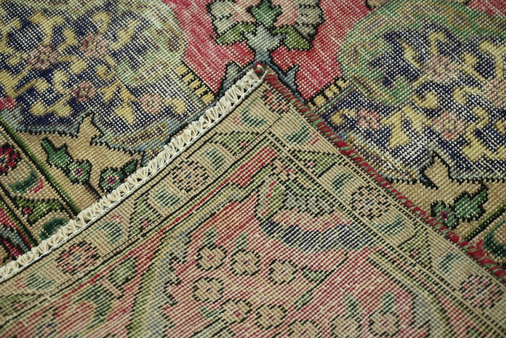 red Medium rug 6' 4" x 9' 0"