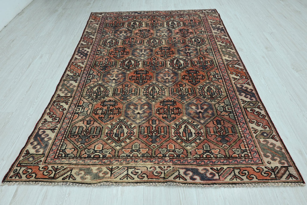 orange Medium rug 5' 10" x 9' 0"