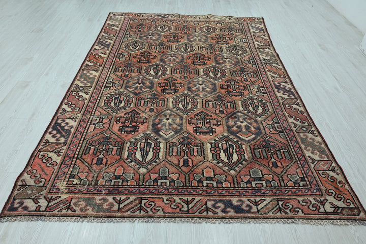 orange Medium rug 5' 10" x 9' 0"