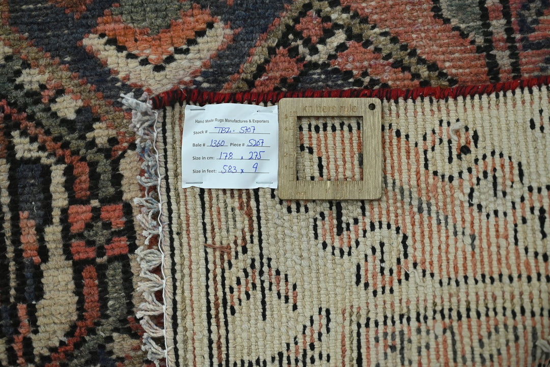 orange Medium rug 5' 10" x 9' 0"