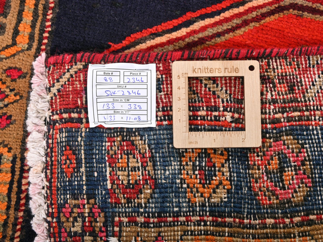 a ruler is on top of a colorful rug