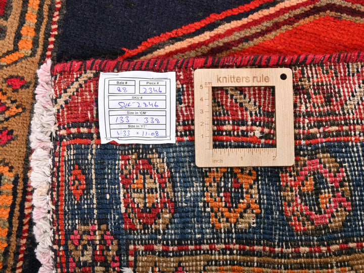 a ruler is on top of a colorful rug