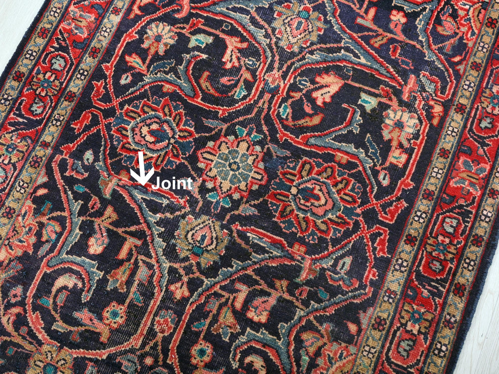 a large oriental rug with an arrow pointing to the center