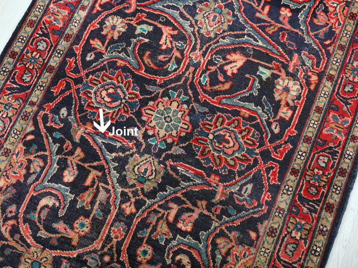 a large oriental rug with an arrow pointing to the center
