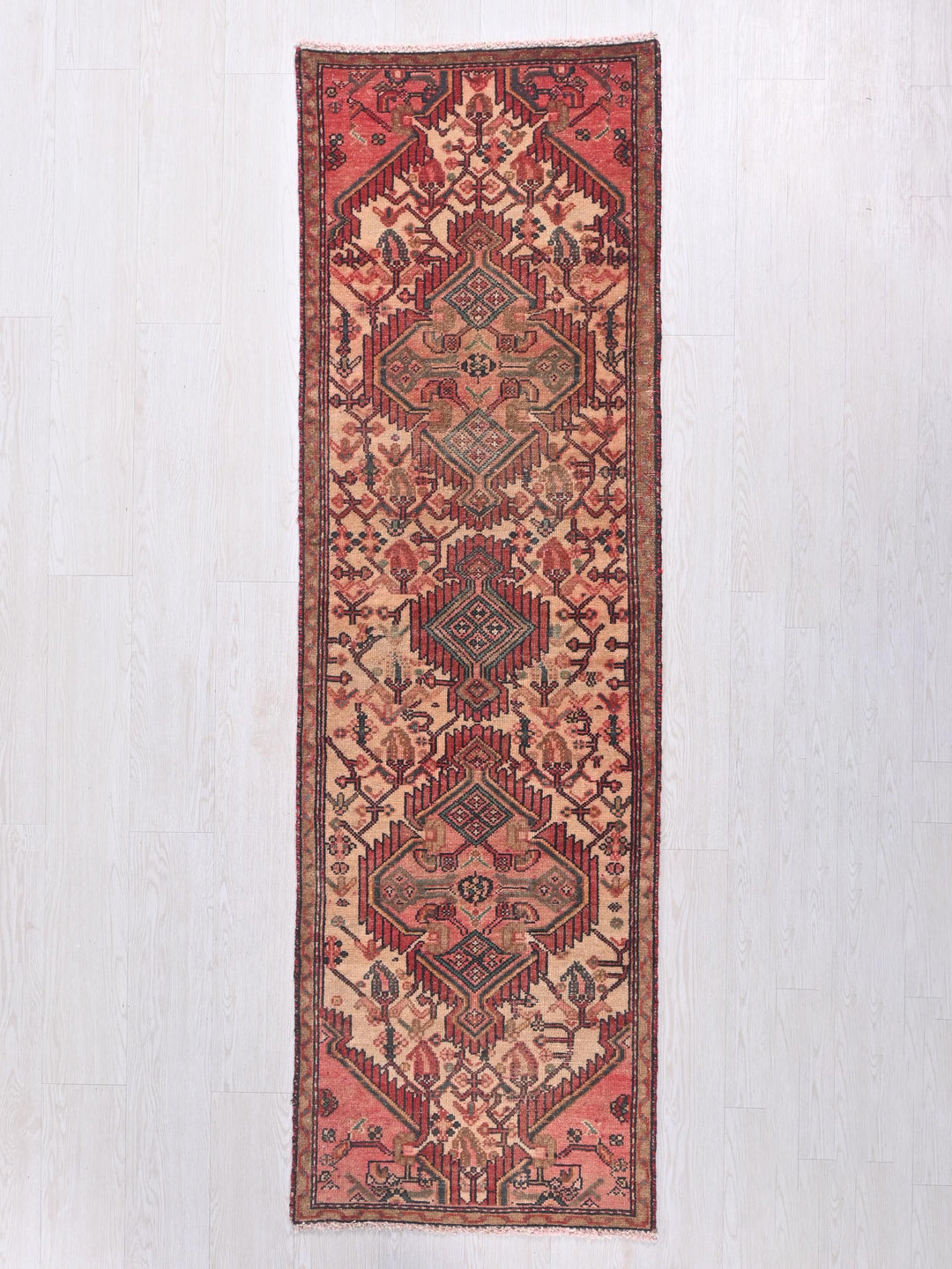 a rug hanging on a wall in a room