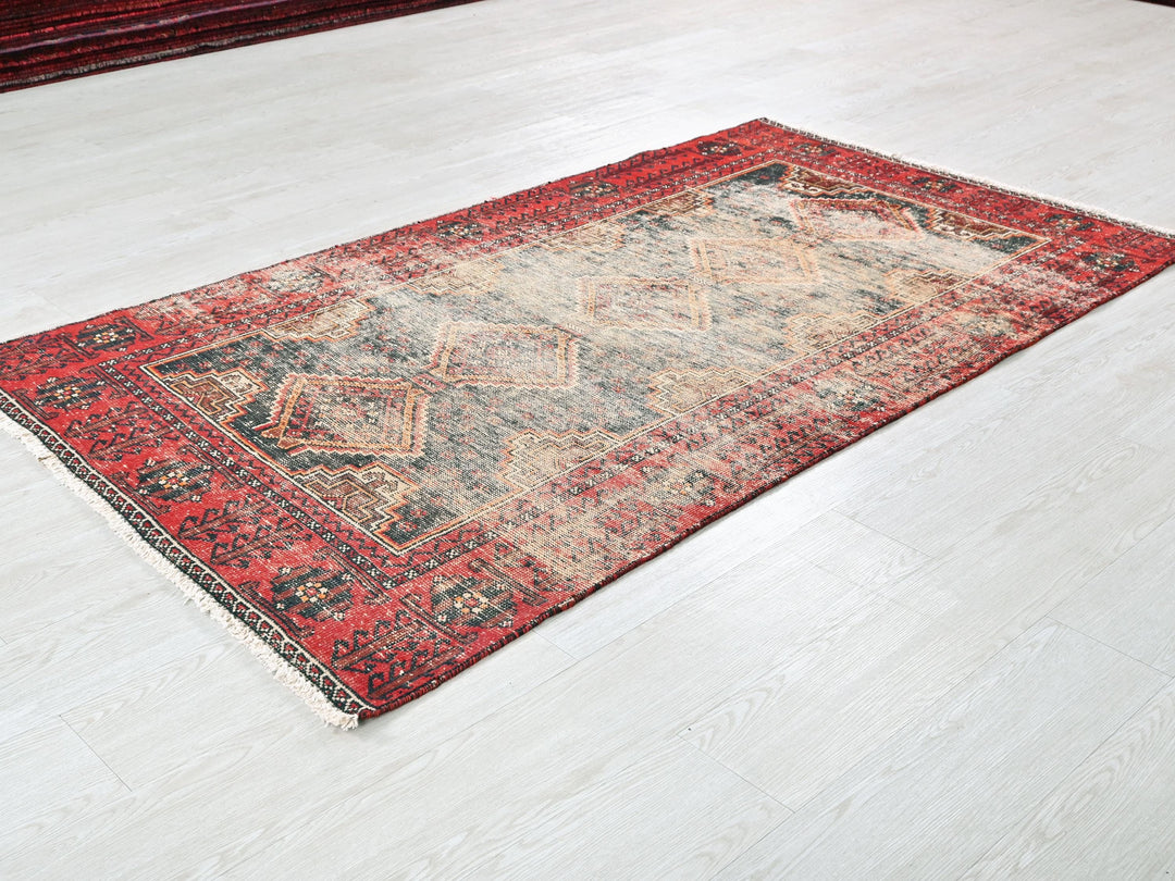 a red rug on a white floor in a room