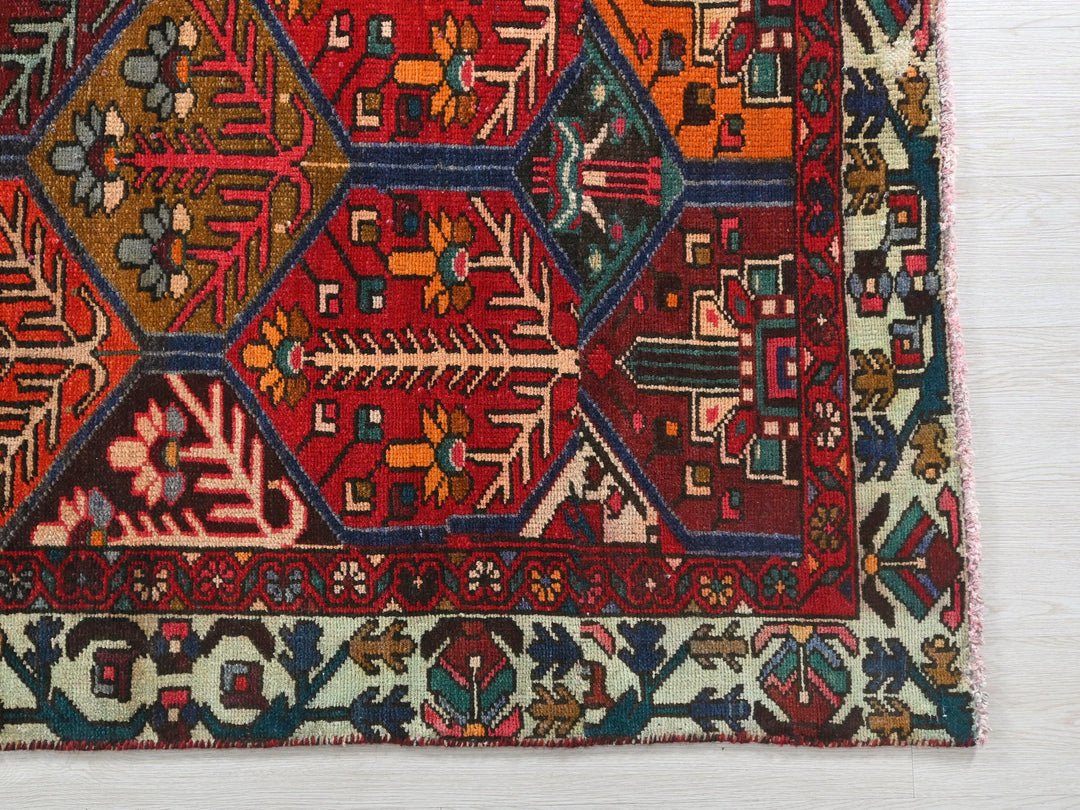 a multicolored rug on a white surface