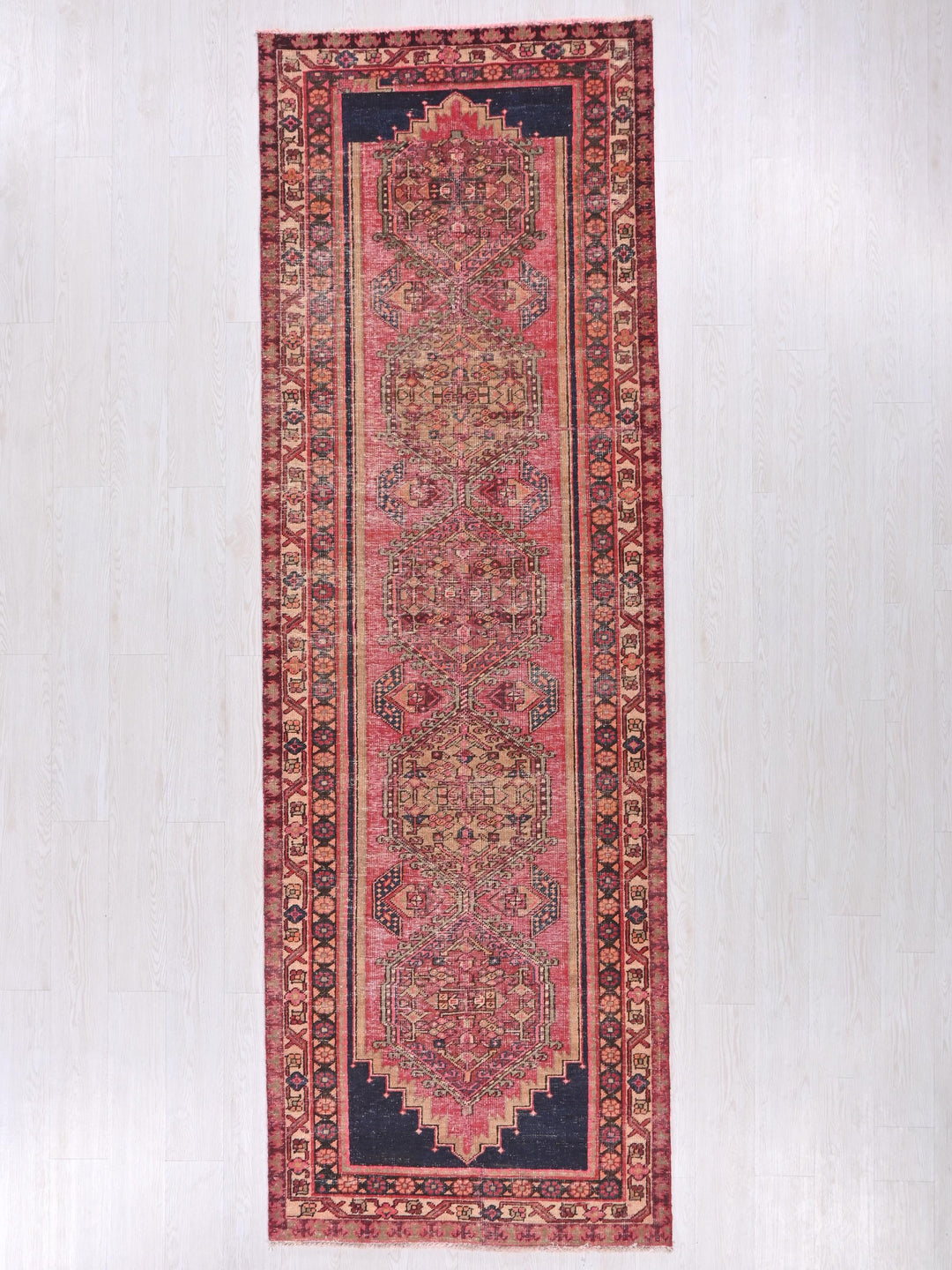 a rug hanging on a wall in a room