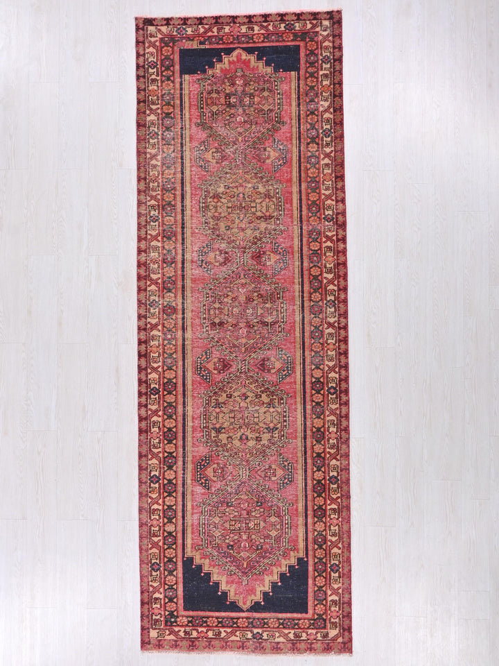 a rug hanging on a wall in a room