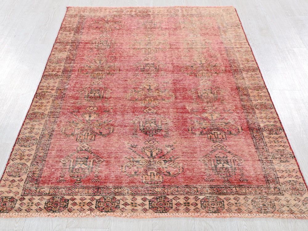 a red rug on a white floor in a room
