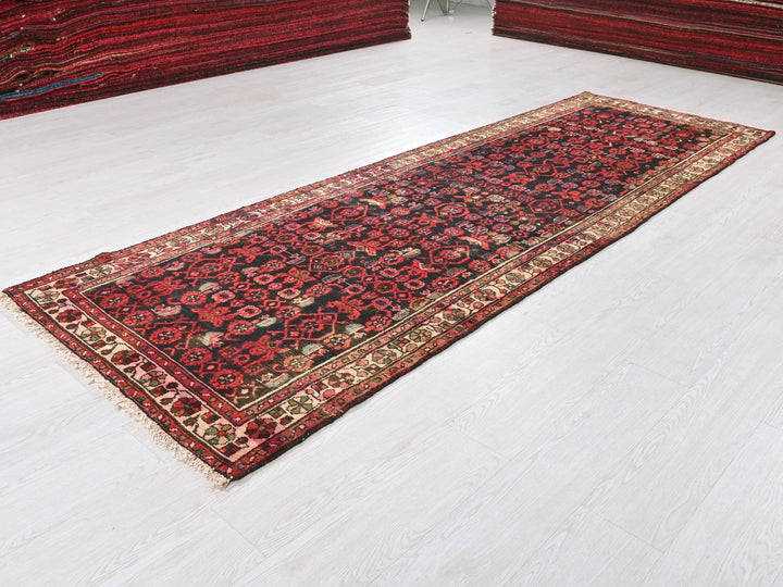 a red rug is laying on the floor