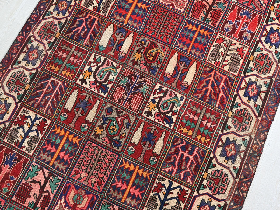 a red rug with many different designs on it