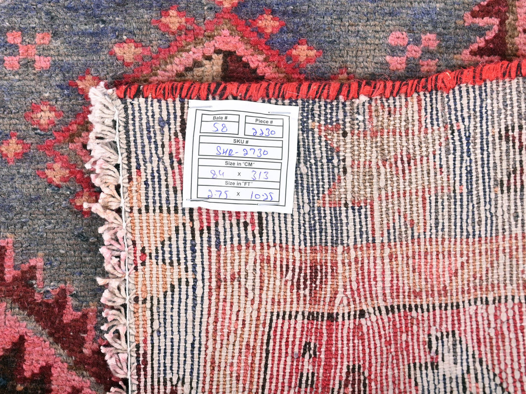 a close up of a rug with a tag on it