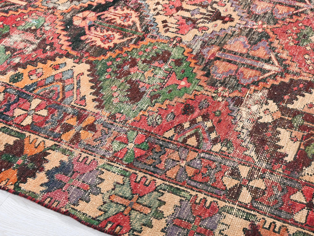 a multicolored oriental rug on a white floor